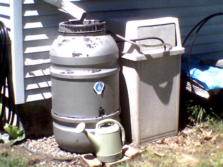 water conservation effort rain captured and used, go green, outdoor living, Pete fixed the down spout to flow into the screened barral opening Water from the gutter fills it surprizing fast An old friend gave this heavy fiberglass trash container to me years ago Now the overflow has place to be saved