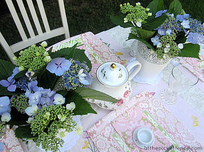 a sweet and simple tea party birthday, crafts, home decor, The girls sat outside under the trees and a quilt made the perfect tablecoth