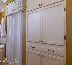 is a large bathroom possible in an old house yes it is, bathroom ideas, home decor, Built in cabinet provides plenty of storage for toiletries and dirty clothes a rare find in an old house bathroom