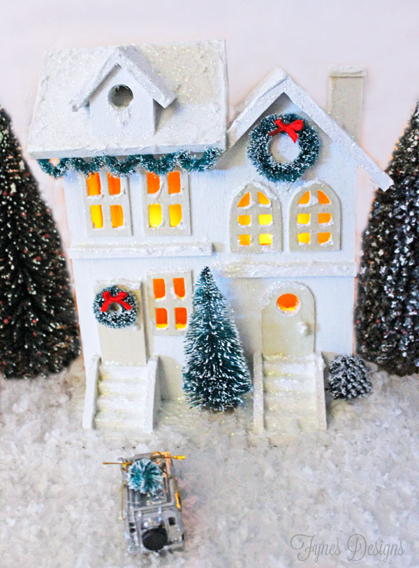 diy white christmas village, christmas decorations, crafts, seasonal holiday decor, wreaths, Use sisal wreaths to decorate the doors and create a garland swag