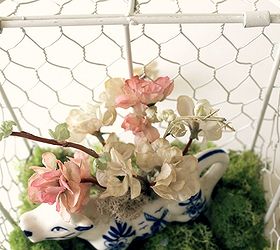 welcome spring with a birdcage, seasonal holiday decor, Use items you have onhand like this pretty cow creamer Create a small floral arrangement for a touch of color