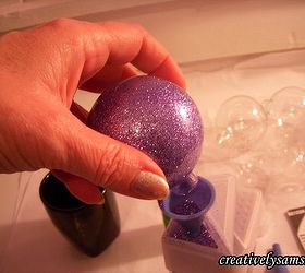 glitter ornaments, christmas decorations, seasonal holiday decor, Coat the inside of the ball with the glitter Pour out the excess glitter back into the glitter container