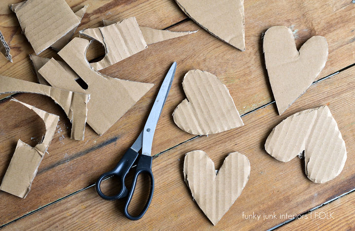 rustic valentines you won t want to take down or give away oops, crafts, valentines day ideas, Hearts were cut free hand out of corrugated cardboard I was after every one being different That worked