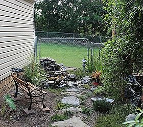 my garden, gardening, outdoor living, This is an after picture of the same area with small water garden and foot path I found the tiny child s bench at an antique store in pieces I planted Carolina Jasmine on trellises between the pillars of the carport