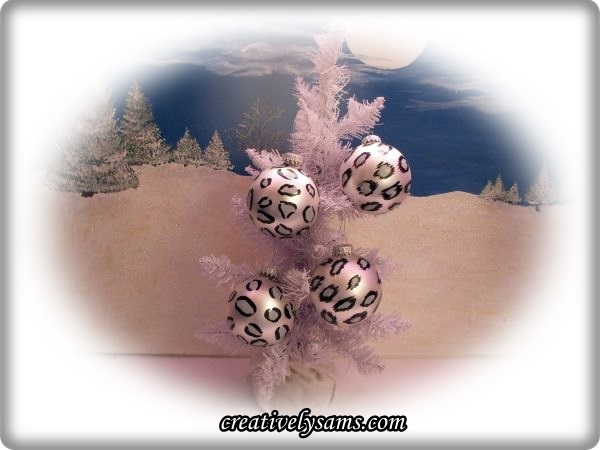 snow leopard ornaments tutorial, christmas decorations, crafts, seasonal holiday decor, These are the finished Christmas Ornaments hanging on a tree
