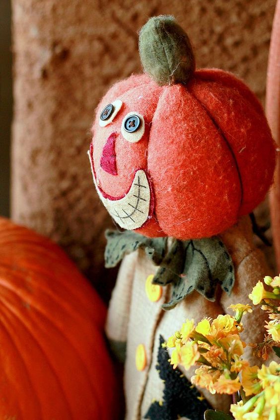 small bursts of fall on the porch, porches, seasonal holiday decor, wreaths, Vintage style pumpkin scarecrow has a welcoming grin