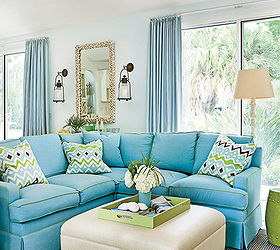 house tour coastal florida home, home decor, An abundance of blue appears prominently on pillows and walls while rugs and upholstered furniture keep things calm and clean Shop the living room