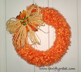 faux pumpkin seed fall wreath, crafts, seasonal holiday decor, wreaths, The bow is made of raffia and I just added a few leaves and berries to finish it off