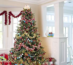 christmas trees 6 ways, seasonal holiday d cor, Garland Nothing could be easier to decorate or deconstruct than a tree wrapped entirely in garlands Chunky knitted garland is the base for felted rings metallic berries and very merry bells