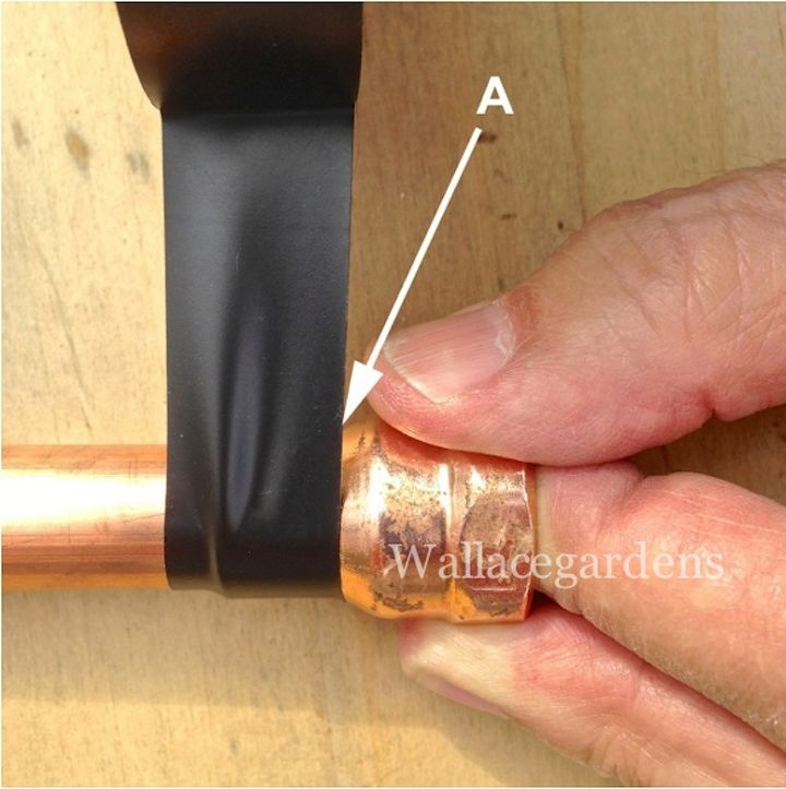 wine bottle watering device with copper tubing for container gardens