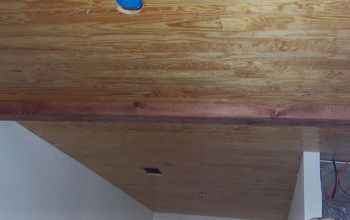 Should my bamboo floor run parallel to my wood ceiling or across it