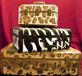 a set of vintage suitcases painted up for stylish storage, repurposing upcycling, storage ideas