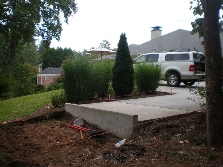 build carport over parking pad and add concrete walkway, Planning for the posts and storage pad
