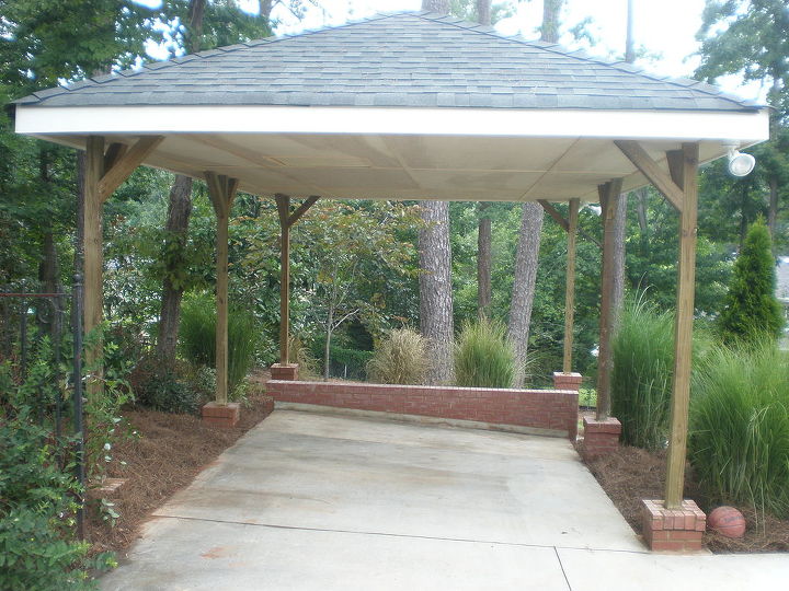 build carport over parking pad and add concrete walkway, Finished front view