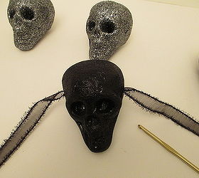 super easy dollar tree glitter skull garland, crafts, halloween decorations, seasonal holiday decor, Pull the ribbon all the way through to the other side