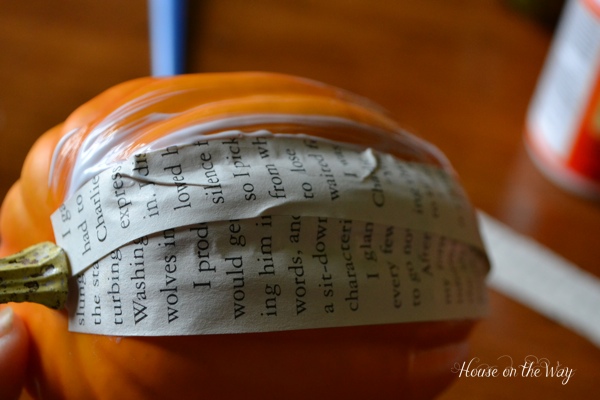 how to decoupage paper pumpkins, crafts, decoupage, seasonal holiday decor, Add strips of paper and top with more Mod Podge