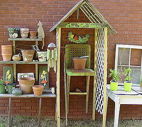 a stroll to my potting area with camera in hand, gardening, outdoor living, repurposing upcycling, The pot house idea began with two discarded windows They are underneath the pallet wood roof