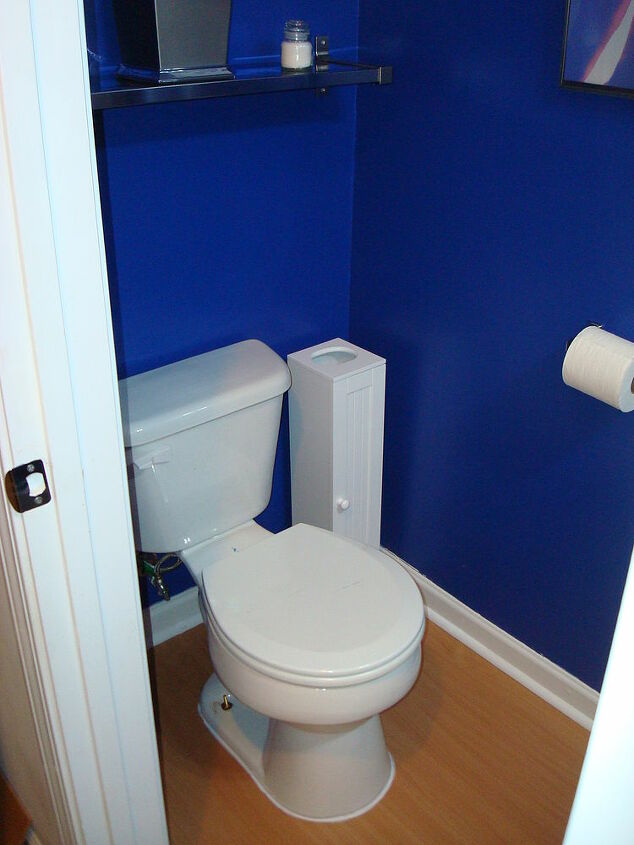 half bath remodel, bathroom ideas, home improvement, After the walls have been painted a laminate floor has been installed and the toilet has been reseated