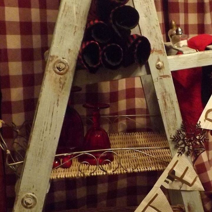 an old but sturdy vintage ladder gets some color and d cor, home decor, repurposing upcycling, rolled placemats fit snuggly in the top slot