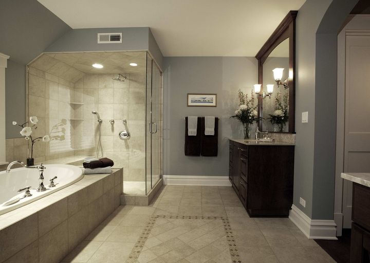 What Colors Go Well In A Gray Bathroom? 11+ Gray Bathroom Ideas To Inspire You! 12 Gray and beige bathroom with dark cabinets and mirror frame.