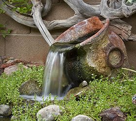 fountains in the garden, outdoor living, ponds water features, A rustic urn flows beneath dramatic driftwood art