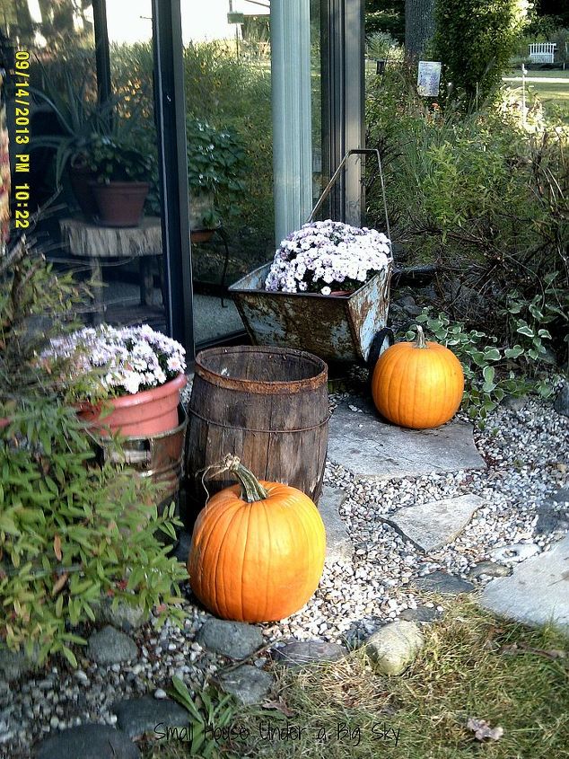 fall deco at the small house using found objects and autumn s bounty, patriotic decor ideas, seasonal holiday d cor, An angled view showcases our pavers and pea gravel landscaping that surrounds The Small House