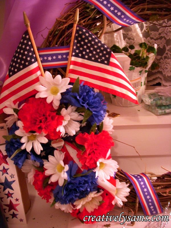 patriotic wreath tutorial, crafts, patriotic decor ideas, seasonal holiday decor, wreaths, Fill in with larger red blue flowers Fill in bare spots with smaller white flowers