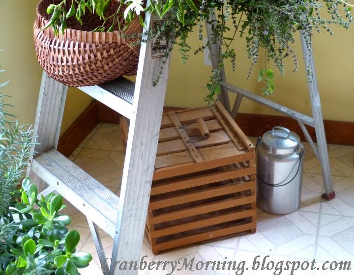 where to put all those houseplants i brought in for the winter, home decor, repurposing upcycling, Bottom part of ladder with a couple vintage items tucked out of the way