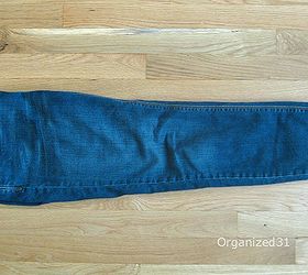 how to fold and organize jeans, organizing, Lay your jeans flat and fold them in half Fold seams together so you don t wear creases down the front of the jeans leg