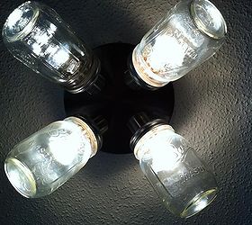 here are some more home made ball mason jar lights, crafts, lighting, mason jars, My son Lance glued the lids to the light and drilled holes for the bulbs he turned an ugly light into a fun one