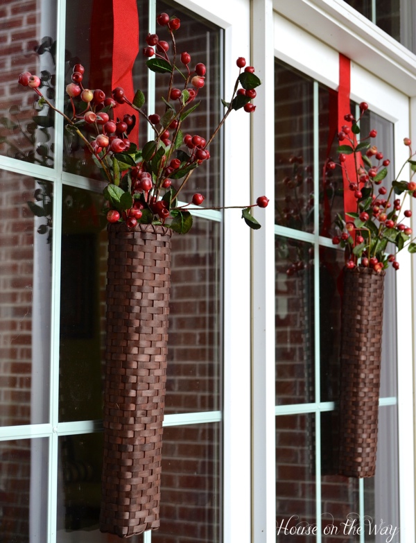 fall porch tour, porches, seasonal holiday decor, wreaths, For my french doors I hung two narrow baskets filled with berry stems Again I used the red burlap ribbon as hangers for the baskets