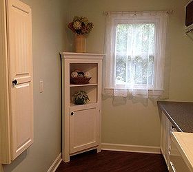 laundry room update, home decor, laundry rooms, Vintage curtains from my Mom turned on the side and clipped up The cabinet had been in our kitchen for years I just painted it The ironingboard cabinet on the left was given wallpaper and paint to match too