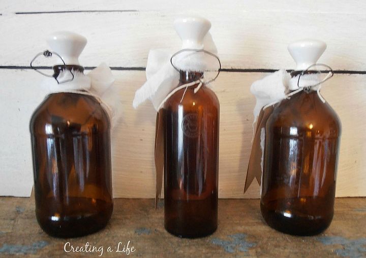 vintage inspired bottles, crafts, repurposing upcycling, seasonal holiday decor, Brown bottles become ornaments by twisting a wire loop around the top