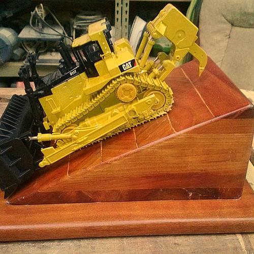 this is a dozer trophy that i made for one of my dear friends, diy, woodworking projects, The dozer is a Model of a D11T from CAT that is made of metal with all working parts