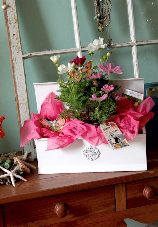 bloomin gifts from salvaged finds, container gardening, gardening, Old mailbox turned colorful and creative gift wrap