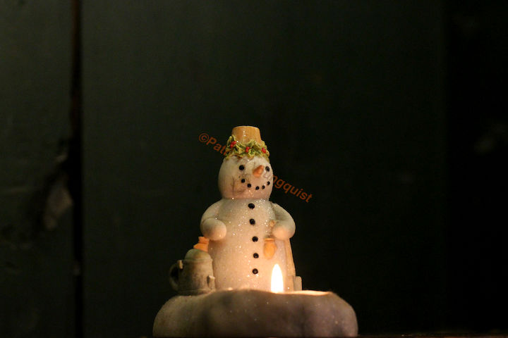 oh christmas tree oh christmas tree how lovely your trunk part 2, seasonal holiday d cor, wreaths, Close up of yet another one of the snowmen sitting by a fire who is admiring the large snowman made by the artist featured