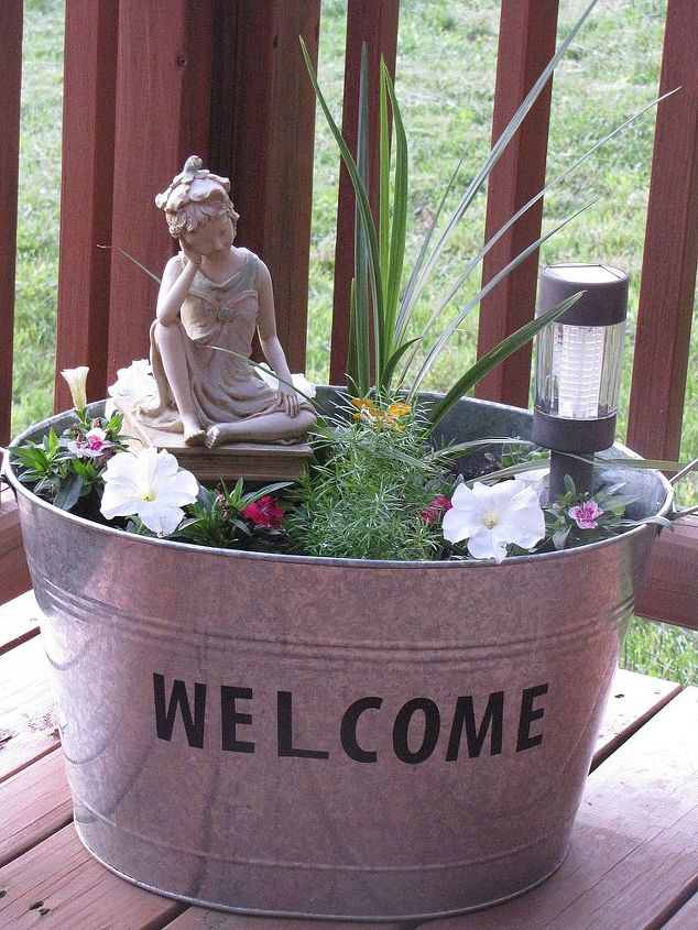 metal galvanized tub turned mini flower garden, flowers, gardening, repurposing upcycling, When it lights up at night with the solar light it is very pretty