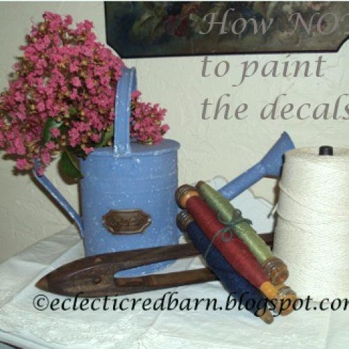 how not to paint decals, home decor, painted furniture, Metal watering can that was rusty and needed to be painted but not the decal