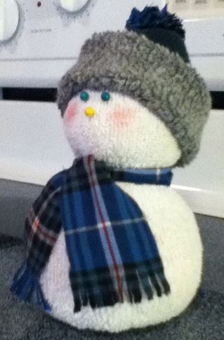 sock snow people, crafts, seasonal holiday decor, This scarf is from my old pj s The hat is also from the toe of a sock I used the pj s to make the tassel also