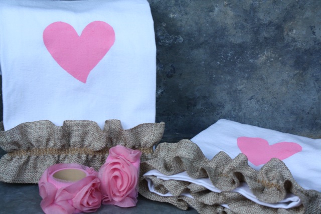 romantic valentine s day table setting valentinesday, seasonal holiday d cor, valentines day ideas, Simple white napkins become festive with paint and burlap trim Wooden napkin rings painted pink and decorated with rose ribbon complete the look
