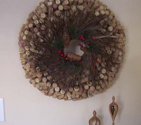 diy cork wreath, crafts, seasonal holiday decor, wreaths, My 1 000 wine cork wreath made from corks wreath form Dollar store twig wreath in front two hand crafted wooden ornaments I had