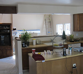 80 s tract home kitchen makeover, countertops, diy, home decor, kitchen cabinets, kitchen design, painted furniture, BEFORE She had a drive thru window above her sink overlooking the family room we removed the upper cabinets for a better sight line and to let more light into the kitchen