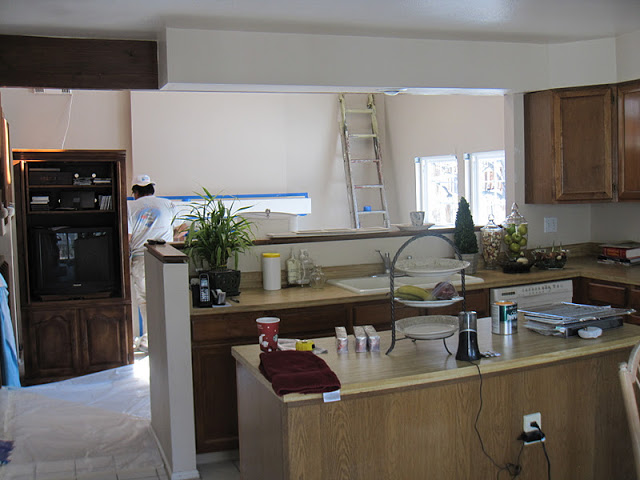 80 s tract home kitchen makeover, countertops, diy, home decor, kitchen cabinets, kitchen design, painted furniture, BEFORE She had a drive thru window above her sink overlooking the family room we removed the upper cabinets for a better sight line and to let more light into the kitchen