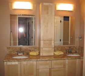 master bathroom makeover on a budget, bathroom ideas, home decor, AFTER TWO new lights and storage room in the middle This is before hardware and tall side cabinet on the left