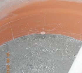 umbrella holder in a cement plant container, holes just above the cement mix