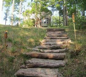creating a creek stone patio fire pit, The stairs were made with fallen trees gravel placed where the ground naturally stepped down
