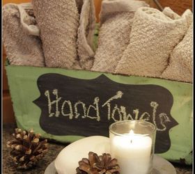 turn a vintage dustpan into a bathroom hand towel station, repurposing upcycling