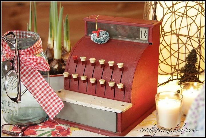 woody pillow and a vintage cash register, seasonal holiday decor