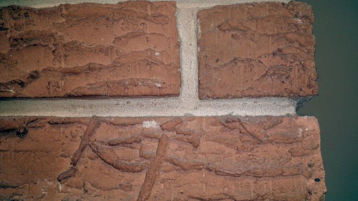 how can i smooth the rough brick on my house for painting, Orange rough brick