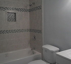 bathroom remodel, bathroom ideas, home improvement, AFTER The finished project painted walls a light blue All tile bought at Home Depot Actually I think all but the tub and tub faucet were bought at Home Depot